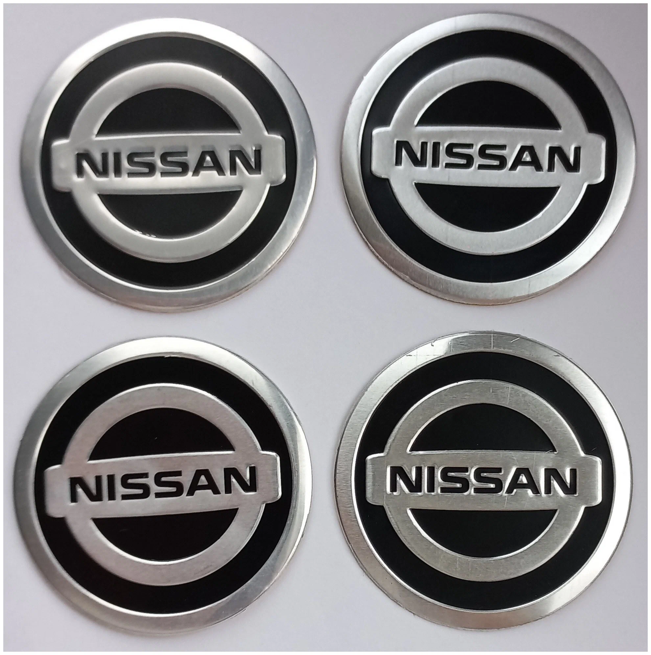 Наклейка ємблема на колісний ковпак або диск d 60 мм Nissan чорна (4 шт.)