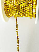 Лента стразовая в цапах желтая 2 мм