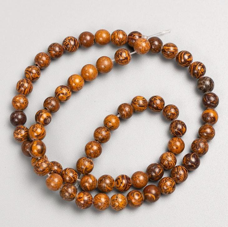 Намистини на волосіні дерев'яна Яшма гладка кулька d-6,5мм+- L-39см+- купити біжутерію дешево оптом в інтернеті