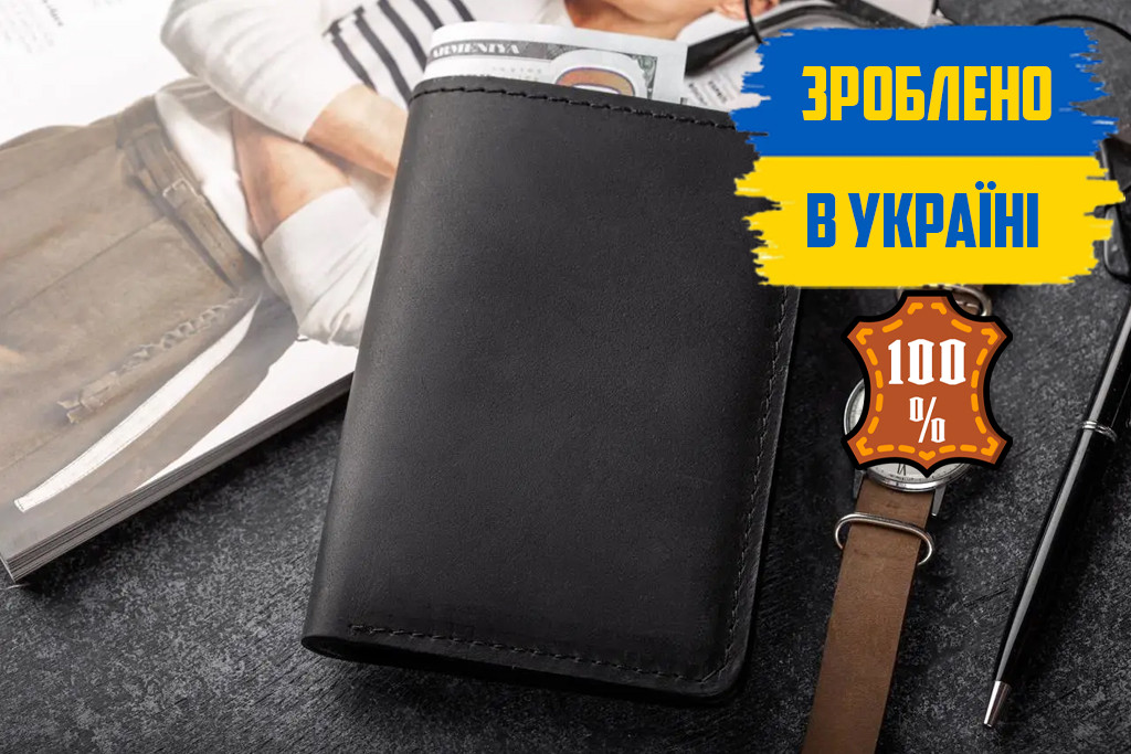 Лаконічний гаманець чоловічий з натуральної шкіри КОСМОПОЛІТ чорний багато відділень