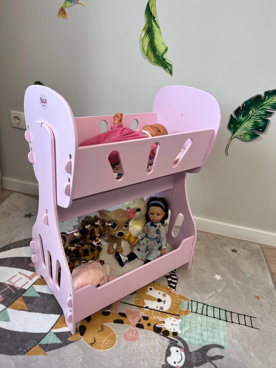 Іграшкова кроватка-качалка рожева дерев'яна для ляльок.