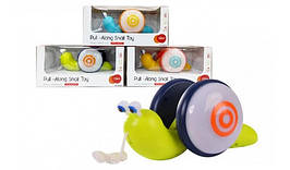 KM1620A Каталка равлика на шнурочку, музика, світло коробка 28*13,5*13,5 см