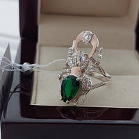 Серебряное кольцо в виде паука каракурта с золотыми напайками, белыми и зеленым фианитами