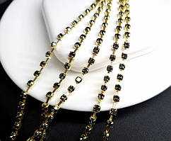 Стразова цепочка Чорний камінь 2мм в золотій оправі (за 1 метр),