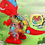 Динозавр музичний (3 кольори, шестерні, ходить, звук, світло, на батарейках) M8018-48, фото 6