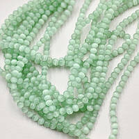 Бусини Котяче Око діаметр 6 мм колір світло-зелений 65 шт.