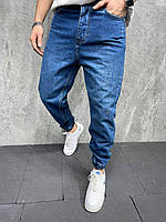 Мужские стильные свободные джинсы МОМ синего цвета на манжетах
