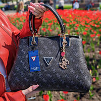 Жіноча сумка чорна саквояж з ручками Модна містка популярна сумочка чорного кольору тиснення