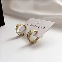 Сережки кільця з переплетенням золотистого кольору