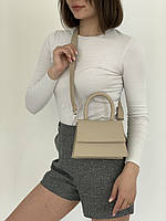 Модная женская сумка клатч с ручкой маленького размера из эко кожи бежевого цвета