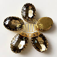 Овал в ажурній золотій оправі Колір Lt Col Topaz Розмір 13х18мм