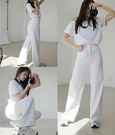 Жіночі білі тонкі джинси кльош у 36 розмірі