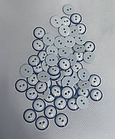 Ґудзики білі із синім обідком на два удари.
 Діаметр 12 мм. Паковання — 100000 шт.