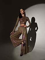 Блискучий трикотажний костюм укорочений топ і брюки кльош з люрексовим напиленням Dvk5498, фото 3