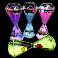 Пісочний годинник антистрес усередині кольоровий гель із блискітками та рибки, що плавають. Розмір: 15*5,5 см