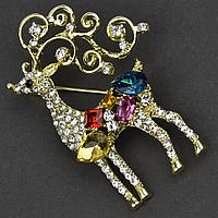 Брошка металева на золотистій основі олень із різнобарвними кристалами та білими стразами розмір 50х20 мм