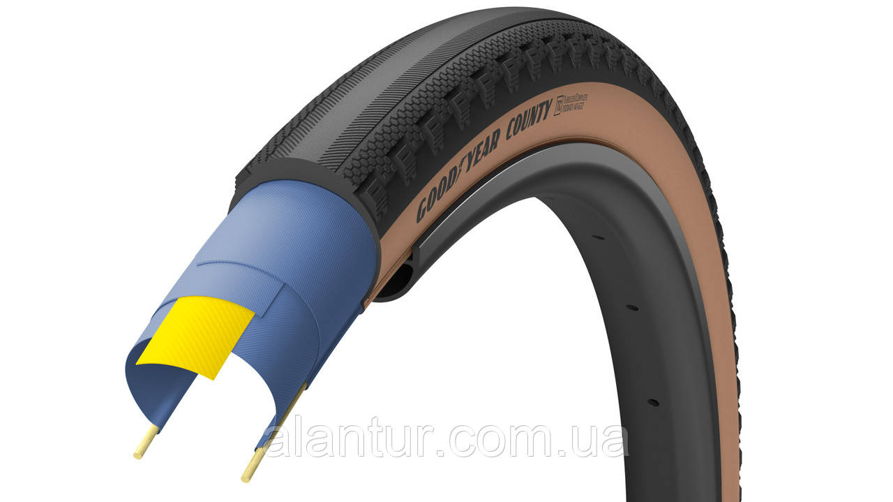 Шина GoodYear COUNTY 700x40, безкамерна, чорна з коричневими боковинами, 120tpi для гравійного велосипеда.