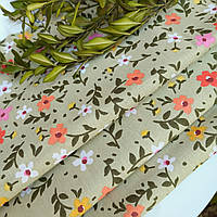 Тканина бавовна для рукоділля різнокольорові квіти на блідо-зеленому тлі