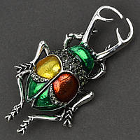 Брошка металева на сріблястій основі жук із сірими стразами покрита кольоровою емаллю розмір 60х30 мм