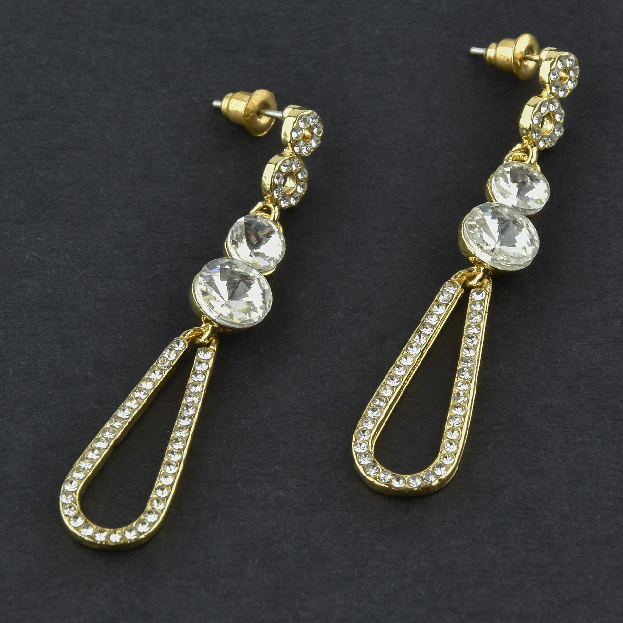 Сережки гвоздики металеві золотисті з білими кристалами віскі довжина 5,5 см ширина 10 мм