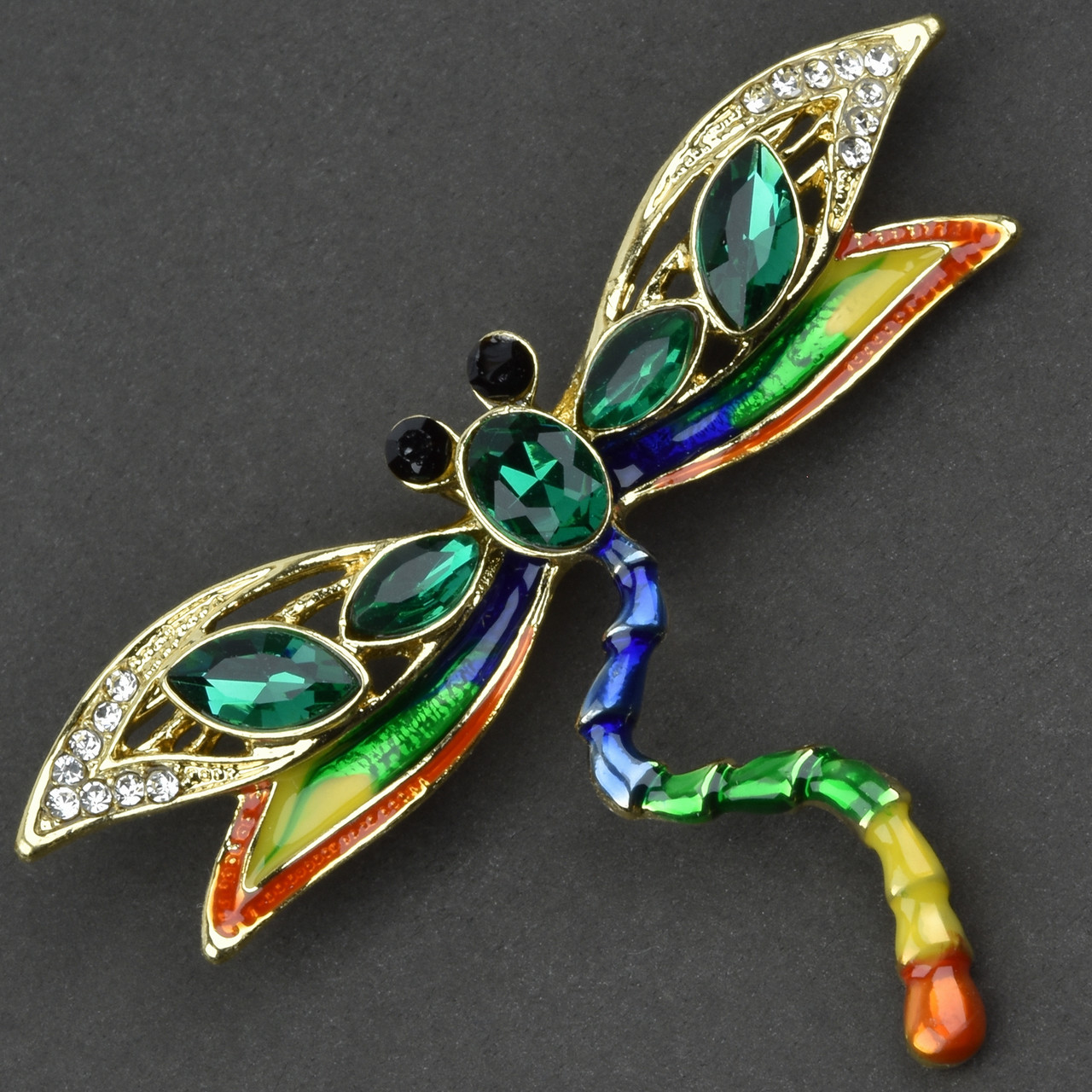 Брошка металева на золотистій основі бабка зі смарагдовими стразами покрита емаллю розмір 50х65 мм