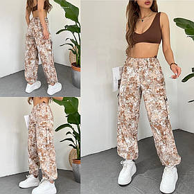 Жіночі плямисті джинси на гумці