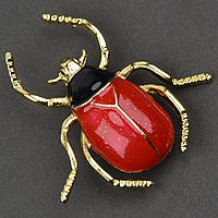 Брошка металева на золотистій основі жук із блискіточками покрита кольоровою емаллю розмір 40х35 мм