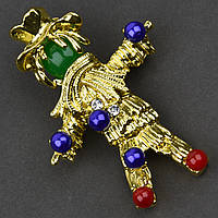 Брошка металева на золотистій основі панчіш із білими стразами та різнобарвними намистинами розмір 55х35 мм