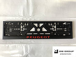 Рамка номерного знаку з написом і логотипом Peugeot чорна - напис: червоного кольору.