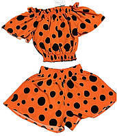 Дитячий літній  костюм для дівчинок топ+шорти-спідниця софт у помаранчевому кольорі у горошок 128,134,140,146