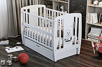 Ліжечко для новонароджених з механізмом заколисування, відкидним бортиком і ящиком "Песик" BabyRoom Білий