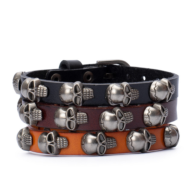 Фото браслет на руку шкіряний з черепами помаранчевий Фото браслет на руку шкіряний з черепами помаранчевий