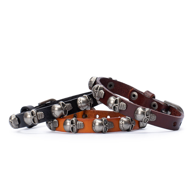 Фото браслет на руку шкіряний з черепами помаранчевий Фото браслет на руку шкіряний з черепами помаранчевий