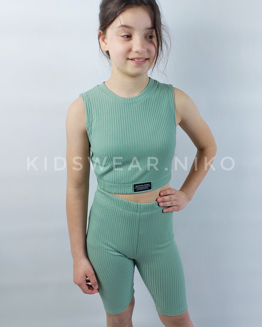 Дитячий літній  костюм для дівчинок топ+велосіпедки рубчік у оливковому кольорі 134,140