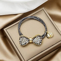 Стильна жіноча гумка для волосся з блискучим об'ємним бантом (чорний)