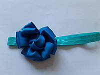 Повязка для ребенка голубого цвета - цветок 7см, размер универсальный (на резинке)