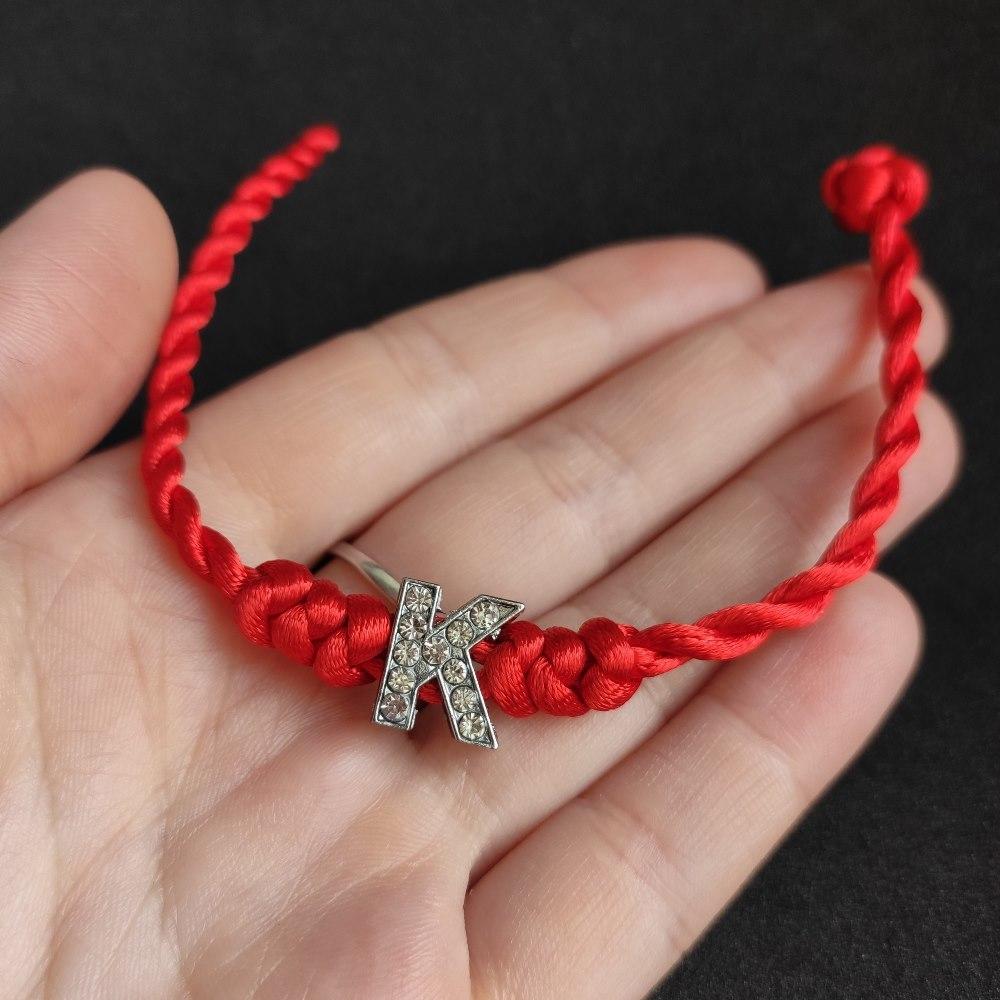 Червона нитка на руку оберіг "All Dreams" з літерою К, фото 1