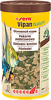 Сухий корм sera Vipan Nature універсальний для всіх акваріумних риб, які харчуються з поверхні води, пластівці