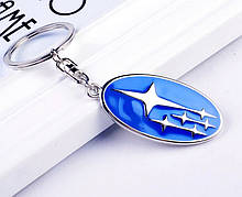 Брелок овальної форми з логотипом Subaru, хром/синій