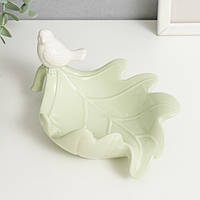 Біла фарфурова статуетка-органайзер самотня пташка на листку