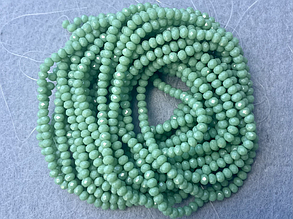 Кришталеві намистини 3*3,5мм, грановані - зелений