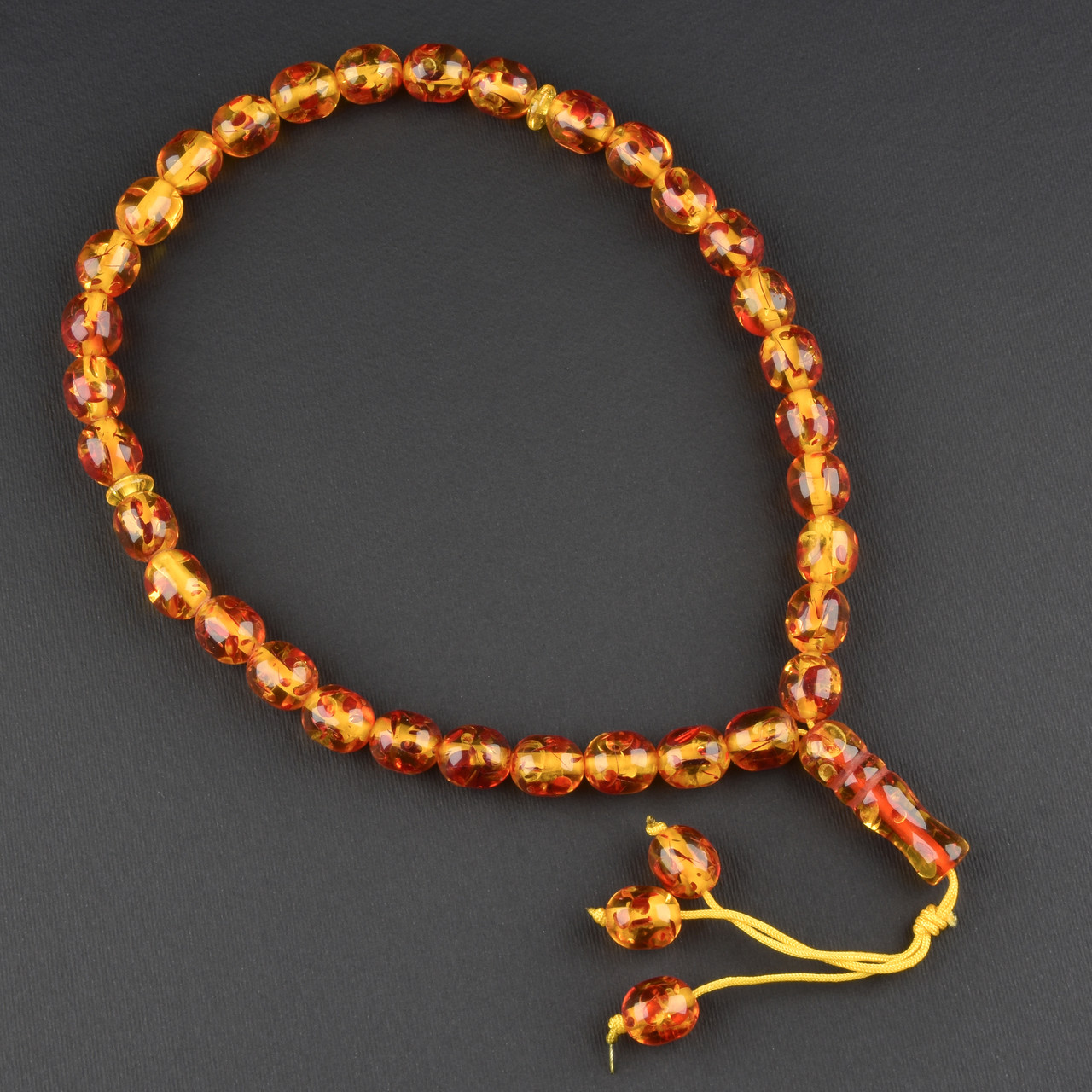 Чітки пластикові з жовтогарячими великими намистинами візерунки та висувною кількістю намистин 33 штуки довжина 70 см - фото 1 - id-p1904388686