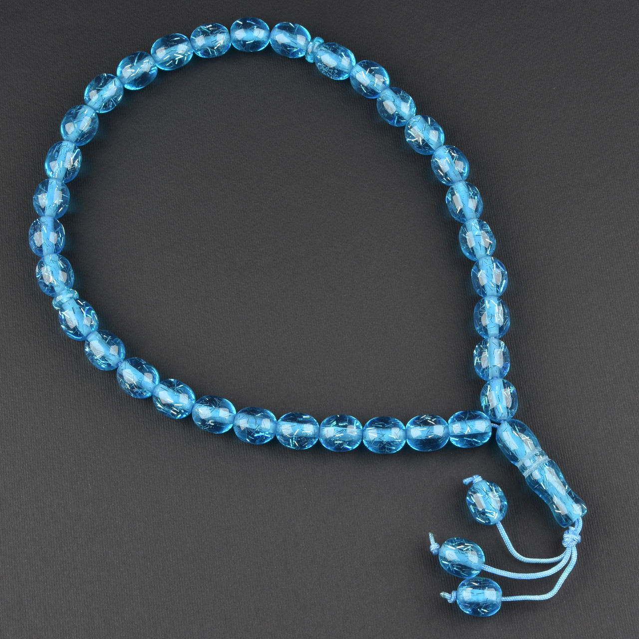 Чітки пластикові з блакитними напівпрозорими намистинами та висулькою кількість намистин 33 штуки довжина 70 см - фото 1 - id-p1904425506