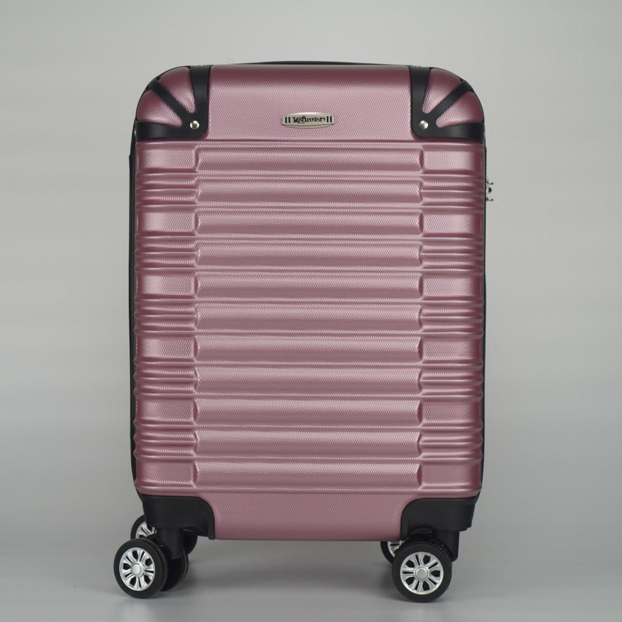 Дорожня середня пластикова валіза на коліщатках рожева 50-літрів