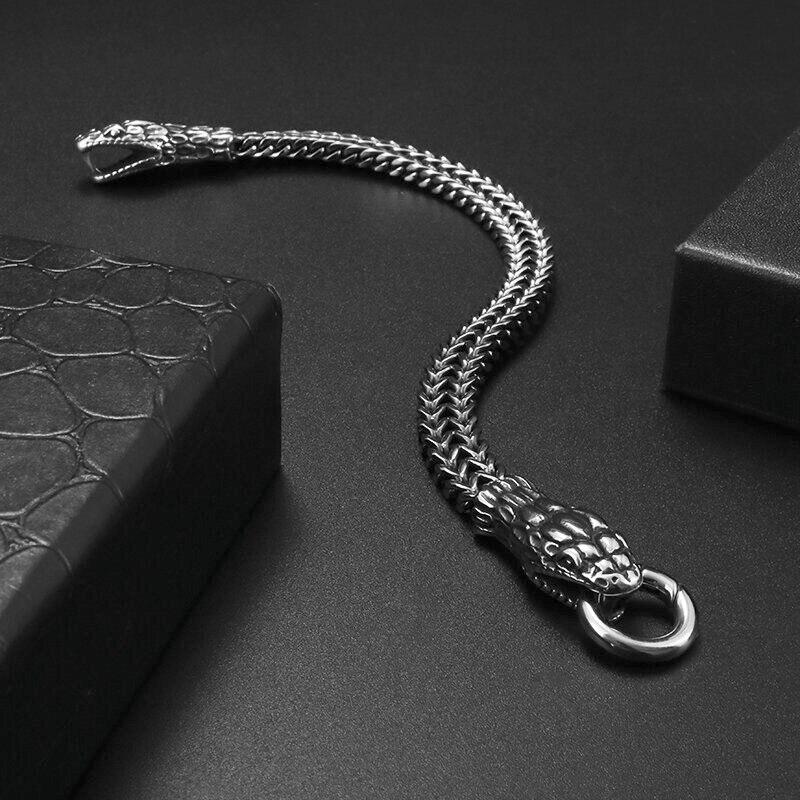 Красивый стальной браслет в виде змеи, браслет змея держит в пасти стальной круг - фото 1 - id-p1912005451