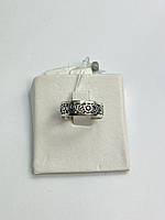 Кольцо серебряное 925 пробы с цветками вырезанными из серебра.