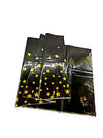 Скатертина поліетиленова Чорнана з золотими зірками 137х183 см
