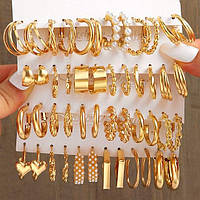 24 пари сережок у комплекті, у золотому кольорі сережки зі штучними перлами