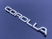 Эмблема - надпись COROLLA 200*20 мм. Логотип на крышку багажника хромированный.