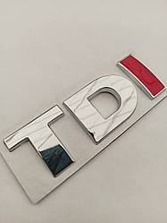 Емблема - напис TDI 76*26 мм "I" червона